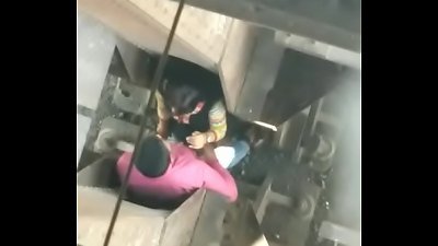 dude and female romance in public place