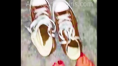 Girl shows her sweaty, stinky Converse sneaker shoes, the insoles are very sweaty and very stinky to wear from barefoot.